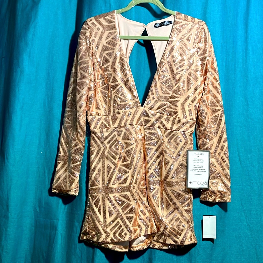 Women’s/juniorors romper.  New with tags. Size 7